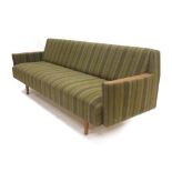 A 1960's green striped three seater sofa with exposed teak arms CONDITION REPORT: