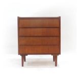 A 1960's teak chest of four overlapping drawers on circular feet, w.