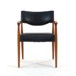 A 1960/70's teak and black vinyl desk chair together with a similar chair bearing a Robin Day for