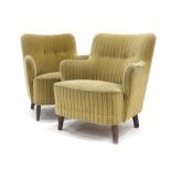A pair of 1940's button upholstered tub armchairs on square tapering feet