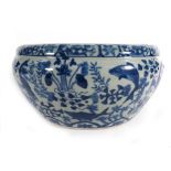 A modern Chinese blue and white jardiniere profusely decorated with carp and floral motifs, d.