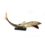 A horn figural ornament modelled as a fish, l.