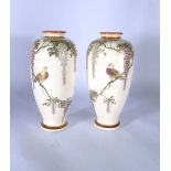 A pair of Japanese satsuma vases of slender baluster form,