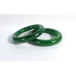 Two green jade bangles,