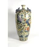 A Chinese vase of elongated melon form having a pair of bat handles,