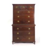 A George III oak chest on chest with an arrangement of three short and six long graduated drawers,