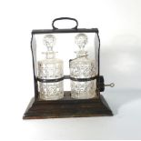 A Walker and Hall 'Holdfast' silver plated locking two-bottle tantalus, w.