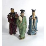 Eight modern Chinese stoneware figures each modelled as a standing male figure, max h. 33.
