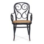 A late 19th/early 20th century Austrian ebonised bentwood and bergere armchair,