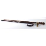 An early 20th century walking stick with a silver collar and a horn handle,