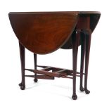 An 18th century mahogany drop-leaf dining table, the 'gates' with spindle stretchers, w.