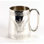 A Victorian silver Christening mug of tapered cylindrical form engraved with flowering shrubs,