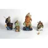 Seven modern Chinese stoneware figures each modelled as a fisherman, max h.