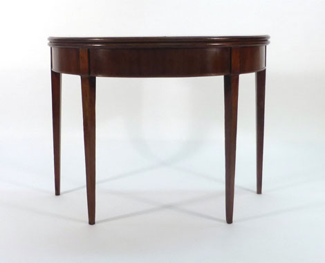 A 19th century mahogany fold-over card table on square tapering legs, w.