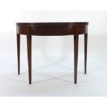 A 19th century mahogany fold-over card table on square tapering legs, w.