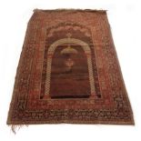 A late 19th century Persian prayer rug,