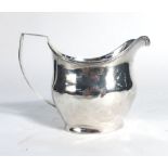 A George III silver milk jug of helmet shaped form, makers mark indistinct, London 1808, h. 9 cm, 3.