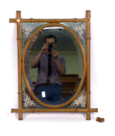 An Aesthetic Movement wall mirror,