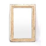 A late 19th century overpainted wall mirror of rectangular form,