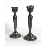 A pair of silver candlesticks of traditional form, Birmingham 1973, h. 18.