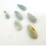 Six pale green jade pendants of seed form, max l. 4.