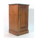 A Victorian stripped pine single door bedside cabinet, w.