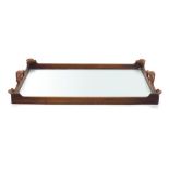 An 18th century and later mahogany butler's tray with a glass base,