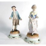 A pair of 18th century-style Sitzendorf porcelain figures modelled as a dandy and his female