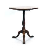 A George III elm tilt-top table, the circular top over a turned column and tripod base, d.