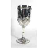 A Victorian silver goblet repousse decorated with floral swags, makers marks indistinct,