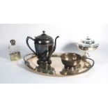 A large selection of silver plated items including trays, place mats, coasters, ice bucket,