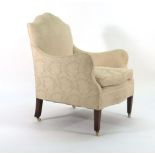 A George III-style upholstered highback armchair on mahogany square tapering legs