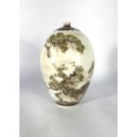 A Japanese eggshell porcelain vase of ovoid form decorated with cranes seated amongst pine trees,