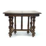 A late Victorian oak extending dining table on a platform base, max. l.