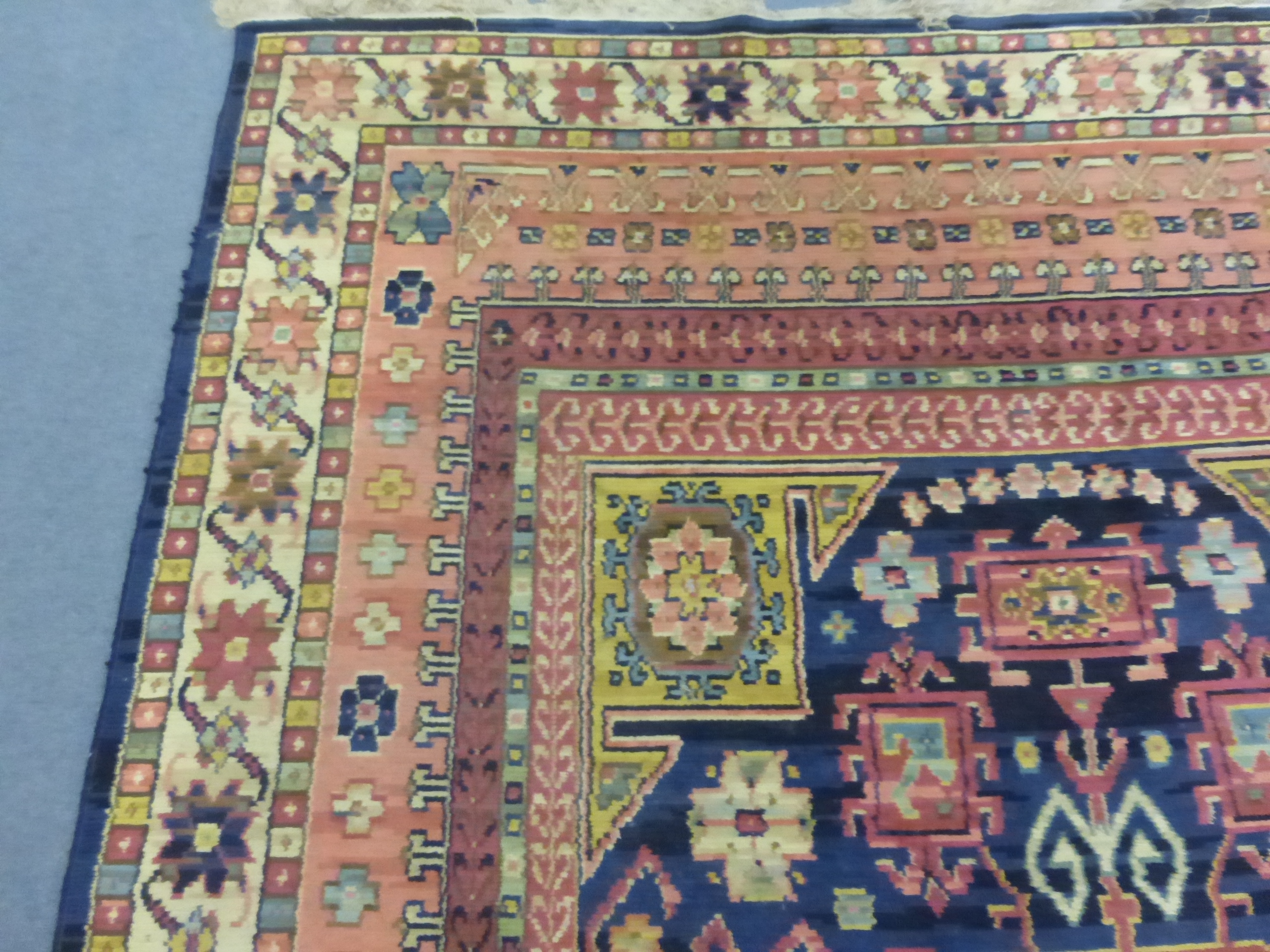 A 1930's woolen rug, - Image 9 of 11