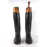 Equestrian Interest: a pair of early 20th century leather riding boots with beech and brass mounted