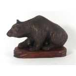 An early 20th century terracotta figure modelled as a bear with cubs,