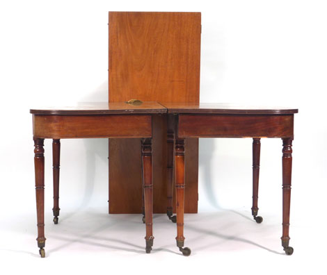 A William IV mahogany reeded dining table, the two D-ends joined by a central leaf,