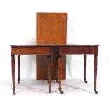 A William IV mahogany reeded dining table, the two D-ends joined by a central leaf,