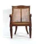 A Victorian mahogany and bergere armchair on turned legs CONDITION REPORT: