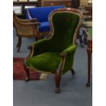 A Victorian mahogany and button upholstered spoon back armchair