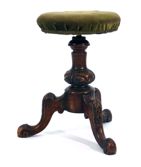 A Victorian mahogany and upholstered music stool