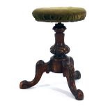A Victorian mahogany and upholstered music stool