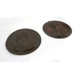 A pair of late 19th century bronze wall plaques relief decorated with a head and shoulders bust of