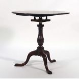 A George III mahogany supper table, the circular top on a birdcage mechanism,