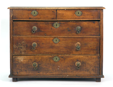 An 18th century and later mahogany chest of two short over three drawers on bun feet, w.