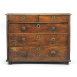 An 18th century and later mahogany chest of two short over three drawers on bun feet, w.