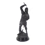An overpainted spelter figure modelled as a soldier on a hardwood base, h.