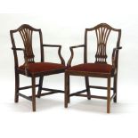 A pair of George III mahogany carvers with drop-in seats on square tapering legs