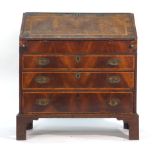 An 18th century and later walnut and crossbanded bureau,